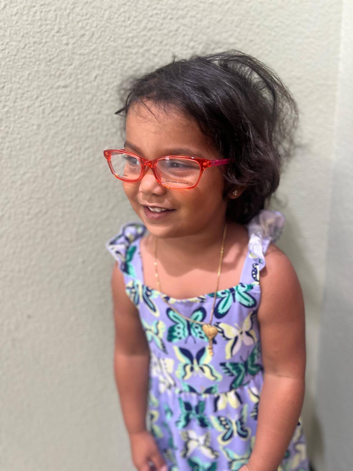 Happy pediatric patient with glasses
